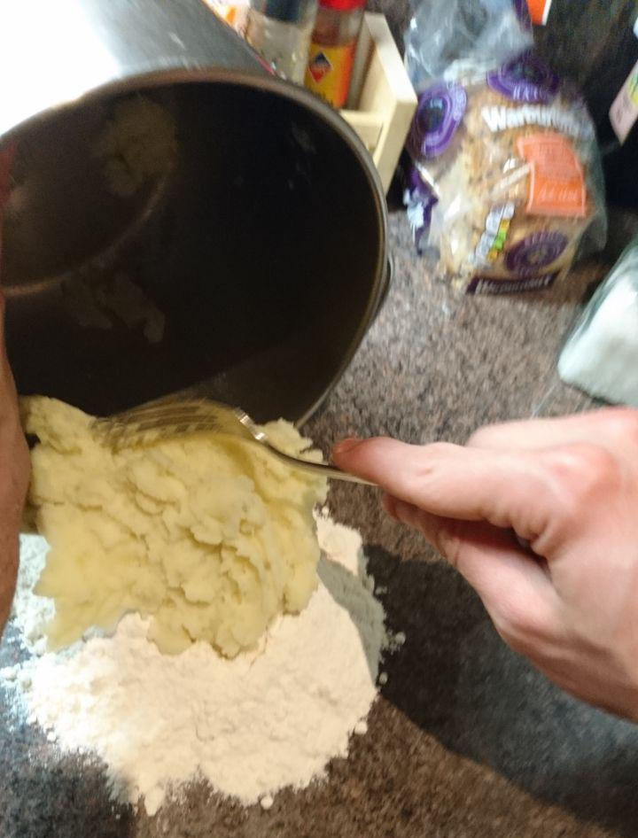 Pouring squashed potatoes